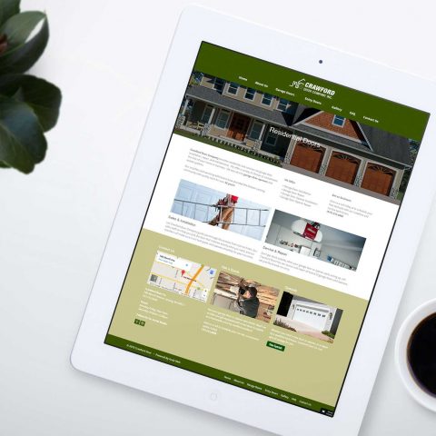 Azula Web Crawford Door Company residential and commercial door website on tablet.