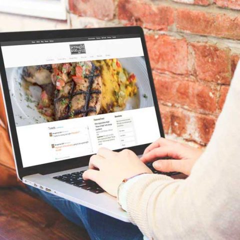 Azula Web Wrought Iron Grill restaurant website on laptop.